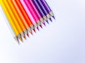 Colorful pencils collection on the paper background