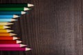 Colorful pencils on dark brown table Royalty Free Stock Photo