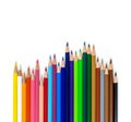 Colorful pencils of different lengths in a row isolated on a white background Royalty Free Stock Photo