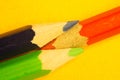 Colorful pencils isolated on yellow. drawing supplies