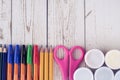 Colorful pencils, markers and pens composition back to school, concept with stationery on a cramped wooden background Royalty Free Stock Photo