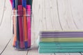 Colorful pencils, markers and pens composition back to school, concept with stationery on a cramped wooden background Royalty Free Stock Photo