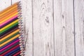 Colorful pencils, markers and pens composition back to school, concept with stationery on a cramped wooden background Royalty Free Stock Photo