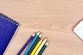 Colorful pencils with notebook and calculator