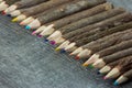 Colorful pencils on old wood background Royalty Free Stock Photo