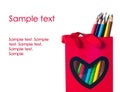 Colorful pencils in a red bag with heart shape