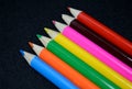 Colorful pencils collection on black background