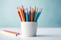 Colorful pencils in white cup table. Generate ai Royalty Free Stock Photo