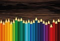 Colorful pencis. Vector on wooden background. Royalty Free Stock Photo