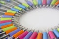 Colorful pens on white background.
