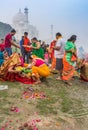 Colorful people at the river behind the Taj Mahal in Agra