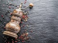 Colorful peppercorns and old pepper mill. Royalty Free Stock Photo