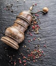 Colorful peppercorns and old pepper mill Royalty Free Stock Photo