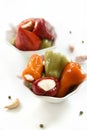 Colorful peppers, sweet and hot, stuffed with cheese, in bowls. Royalty Free Stock Photo