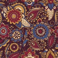 Colorful Persian paisley seamless pattern with buta motif and oriental floral mehndi elements on dark background. Motley Royalty Free Stock Photo