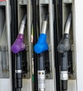 Colorful Petrol pump filling nozzles, Gas station in a service in daytime Royalty Free Stock Photo