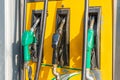 Colorful Petrol pump filling nozzles, Gas station in a service Royalty Free Stock Photo