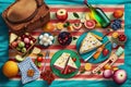 colorful picnic blanket with delicious spread of fruits and cheeses
