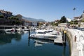 Colorful picturesque houses along the river with small boats captured in Llanes, Spain