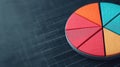 Colorful pie chart segment on a dark background, representing data visualization and analysis concepts Royalty Free Stock Photo