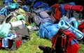 Colorful pile of knapsacks of Scouts during an excursion in the Royalty Free Stock Photo