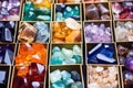 colorful piles of gemstones ready to be set into lockets