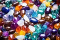 colorful piles of gemstones ready to be set into lockets