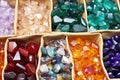 colorful piles of gemstones ready to be set into lockets