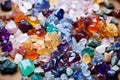 colorful piles of gemstones ready to be set into lockets