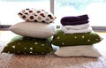 Colorful pillows and blankets on the woolen carpet Royalty Free Stock Photo