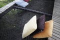 Colorful pillows on net seat among nature