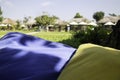 Colorful pillows on net seat among nature