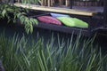 Colorful pillows on net seat among nature