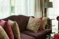 Colorful pillows on red sofa in luxury living room Royalty Free Stock Photo