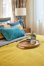 Colorful pillows on wooden bed in modern bedroom Royalty Free Stock Photo