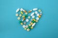 Colorful pills and capsules in the shape of heart Royalty Free Stock Photo