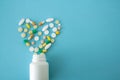 Colorful pills and capsules in the shape of heart Royalty Free Stock Photo