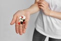 colorful pills in the palm of your hand pain reliever health treatment pharmacology Royalty Free Stock Photo
