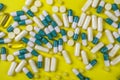 colorful pills and tablets on yellow background Royalty Free Stock Photo