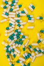 colorful pills and tablets on yellow background Royalty Free Stock Photo