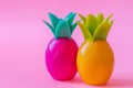 Colorful pineapples on pink background