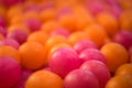 Colorful pink/orange plastic ball stack.