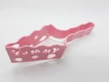 Colorful Pink Plastic cake cutter in White Isolated Background 01 Royalty Free Stock Photo