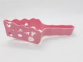 Colorful Pink Plastic cake cutter in White Isolated Background 03 Royalty Free Stock Photo