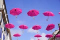 Colorful pink umbrellas cancer decorative symbol hanging on the street Royalty Free Stock Photo