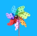 Colorful pinwheel on blue background Royalty Free Stock Photo