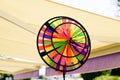 Colorful pinwheel in city street for children wheels play wind in plastic Royalty Free Stock Photo