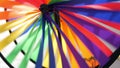 Colorful pinwheel spinning, weather wind vane, garden decoration in USA. Rainbow symbol of childhood, fantasy and imagination