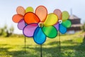 Three colorful pinwheel toys near the ocean Royalty Free Stock Photo