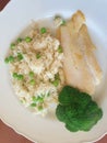 Colorful placemat meal in green and white, healthy, poultry, rice, peas and broccoli